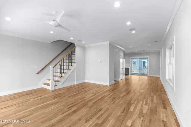 a view of an empty room and wooden floor