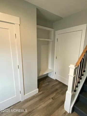 a view of an entryway with wooden floor