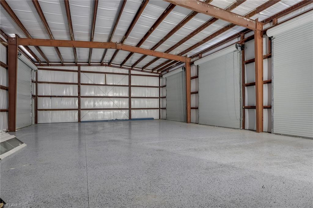 730 29th Street Southwest Naples, FL 34117 - Photo 43 of 50 Garage featuring metal wall