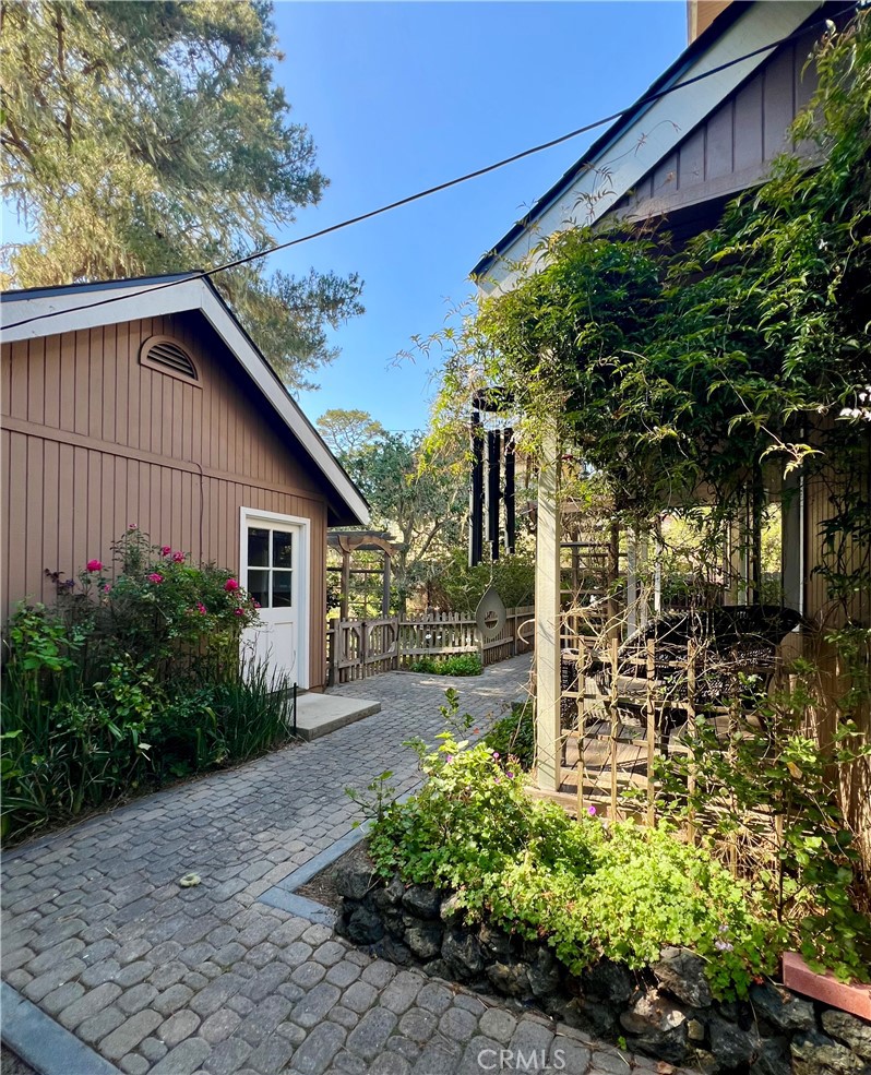 1530 Emerson Road Cambria, CA 93428 - Photo 7 of 54 West side of walkway looking at separate garage