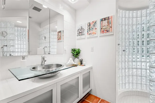 a bathroom with a sink a vanity and a mirror
