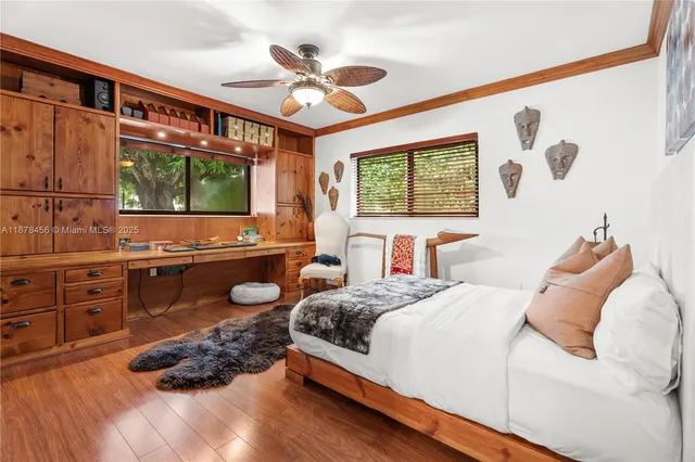 a bedroom with a large bed and a large window