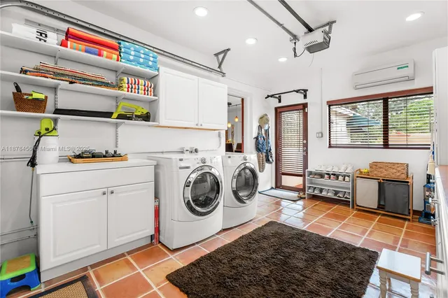 a utility room with sink dryer and washer