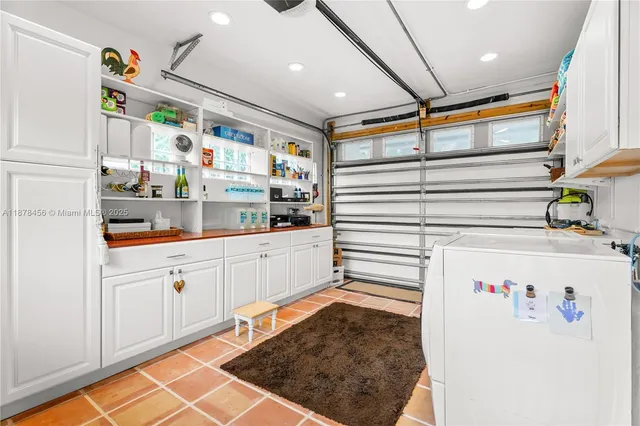 a kitchen with stainless steel appliances granite countertop a refrigerator and a stove
