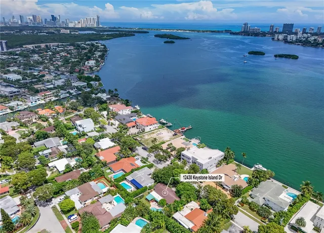 an aerial view of a house with a yard and garden
