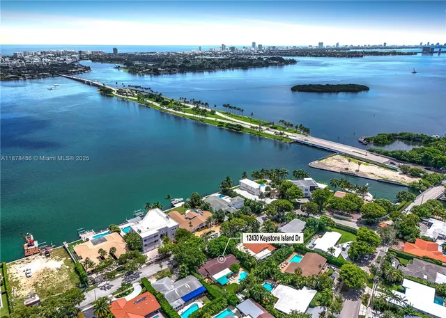a view of a lake with lawn chairs