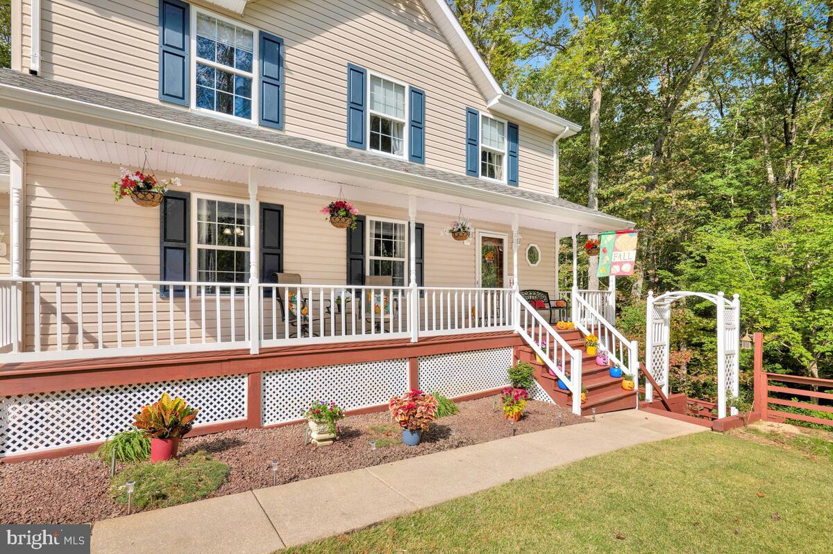 165 Ball Road St. Leonard, MD 20685 - Photo 4 of 55 front view of a house with a yard