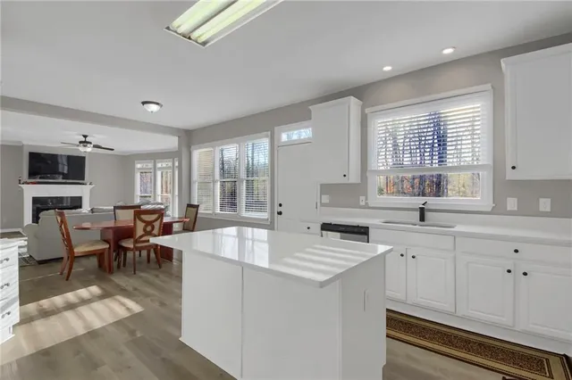 a large white kitchen with lots of counter top space