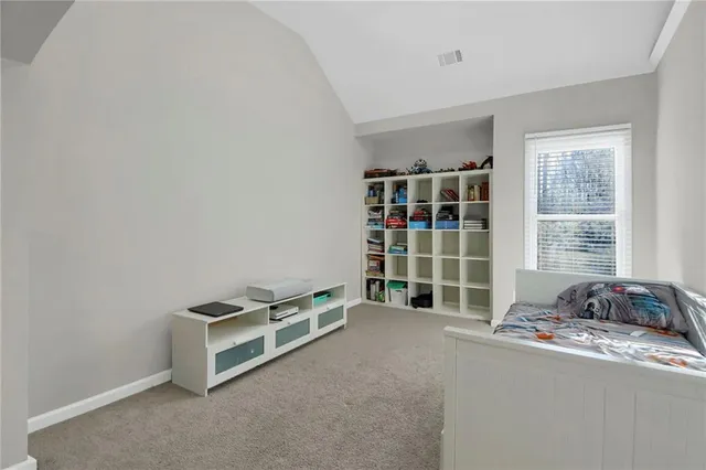 a room with a bed and a window