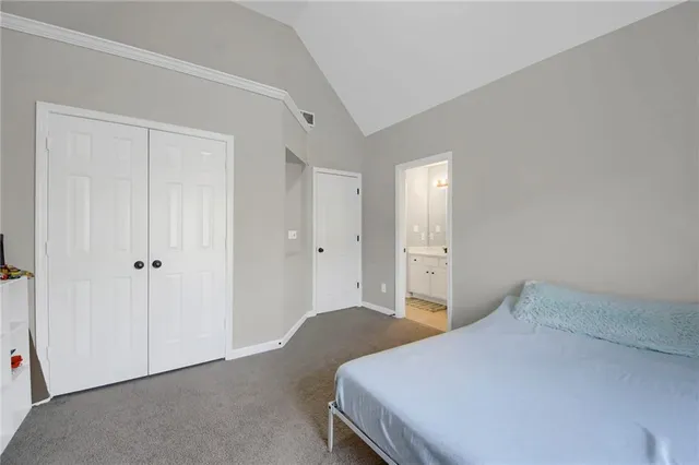a bedroom with a bed and hallway