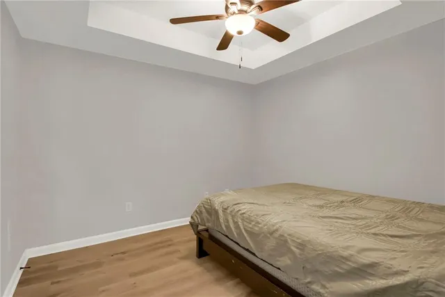 a bedroom with a bed and cabinets
