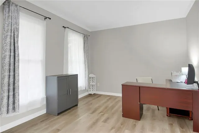 a workspace with furniture and wooden floor