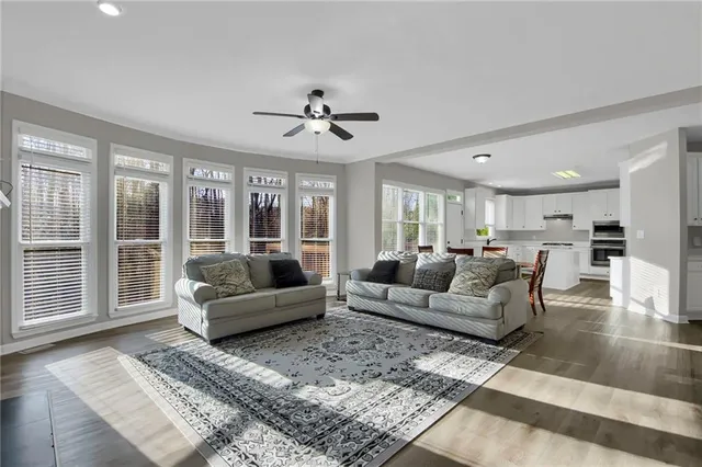 a living room with furniture and a large window