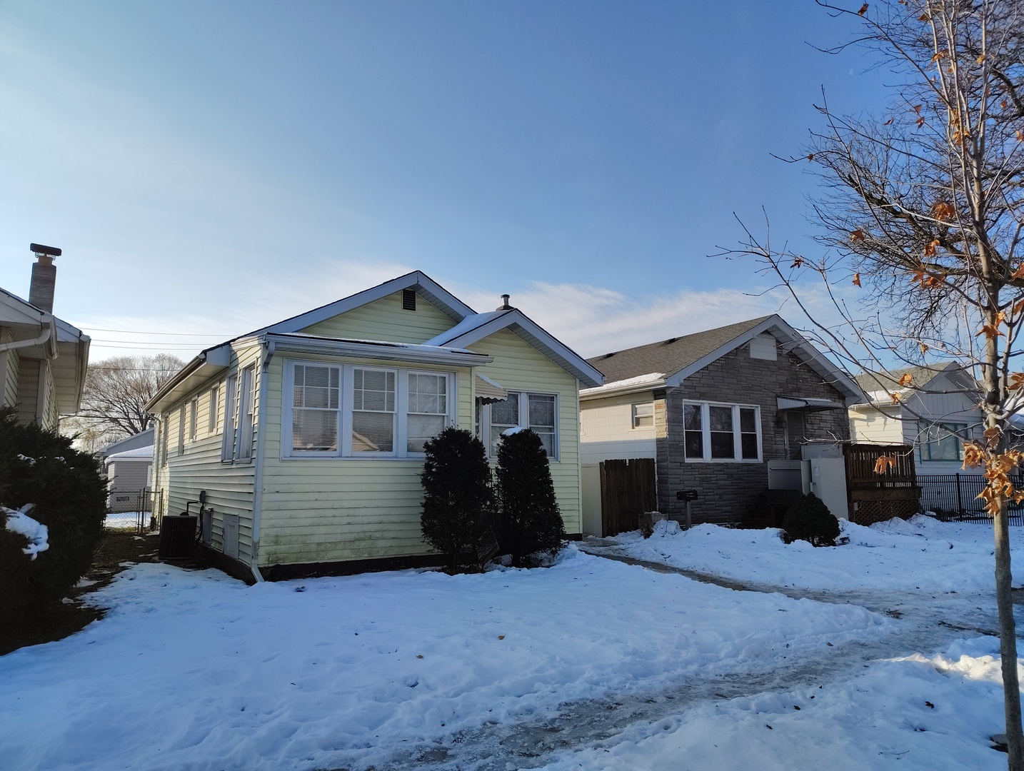 5541 West Grace Street Chicago, IL 60641 - Photo 1 of 26 a front view of a house with a yard