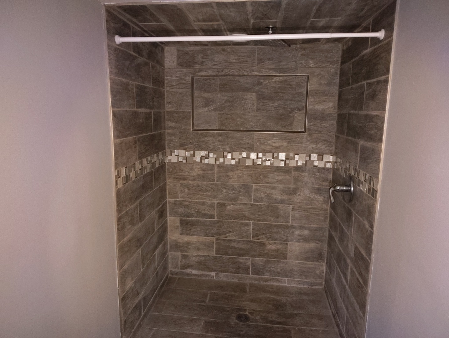 5541 West Grace Street Chicago, IL 60641 - Photo 18 of 26 a bathroom with a shower