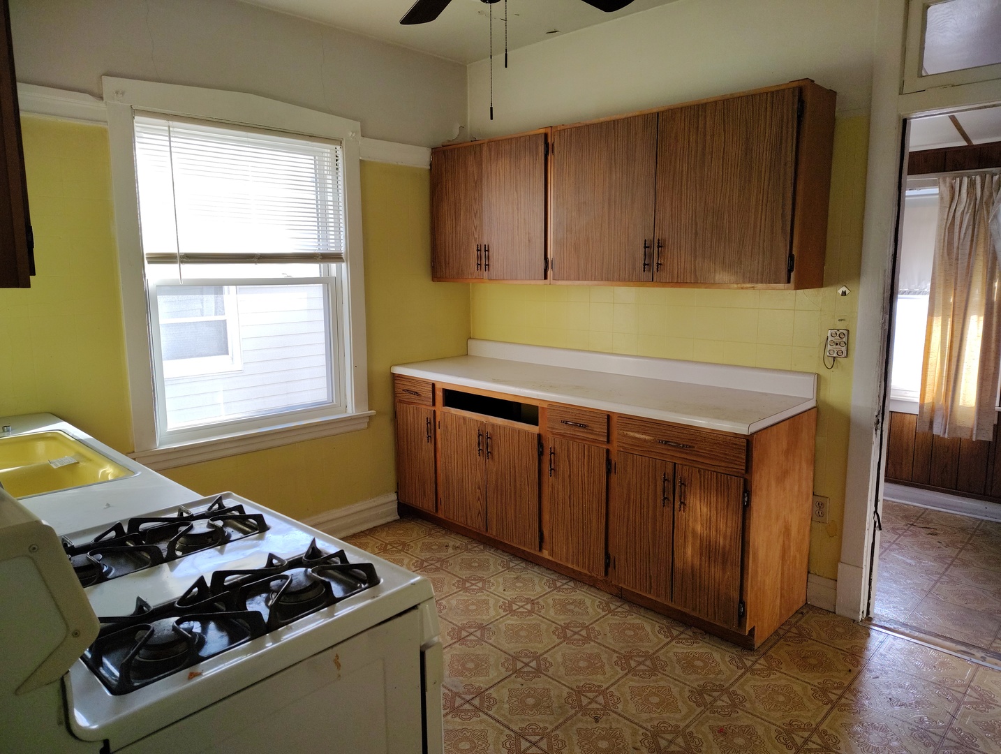 5541 West Grace Street Chicago, IL 60641 - Photo 10 of 26 a kitchen with stainless steel appliances granite countertop a stove a sink and a refrigerator