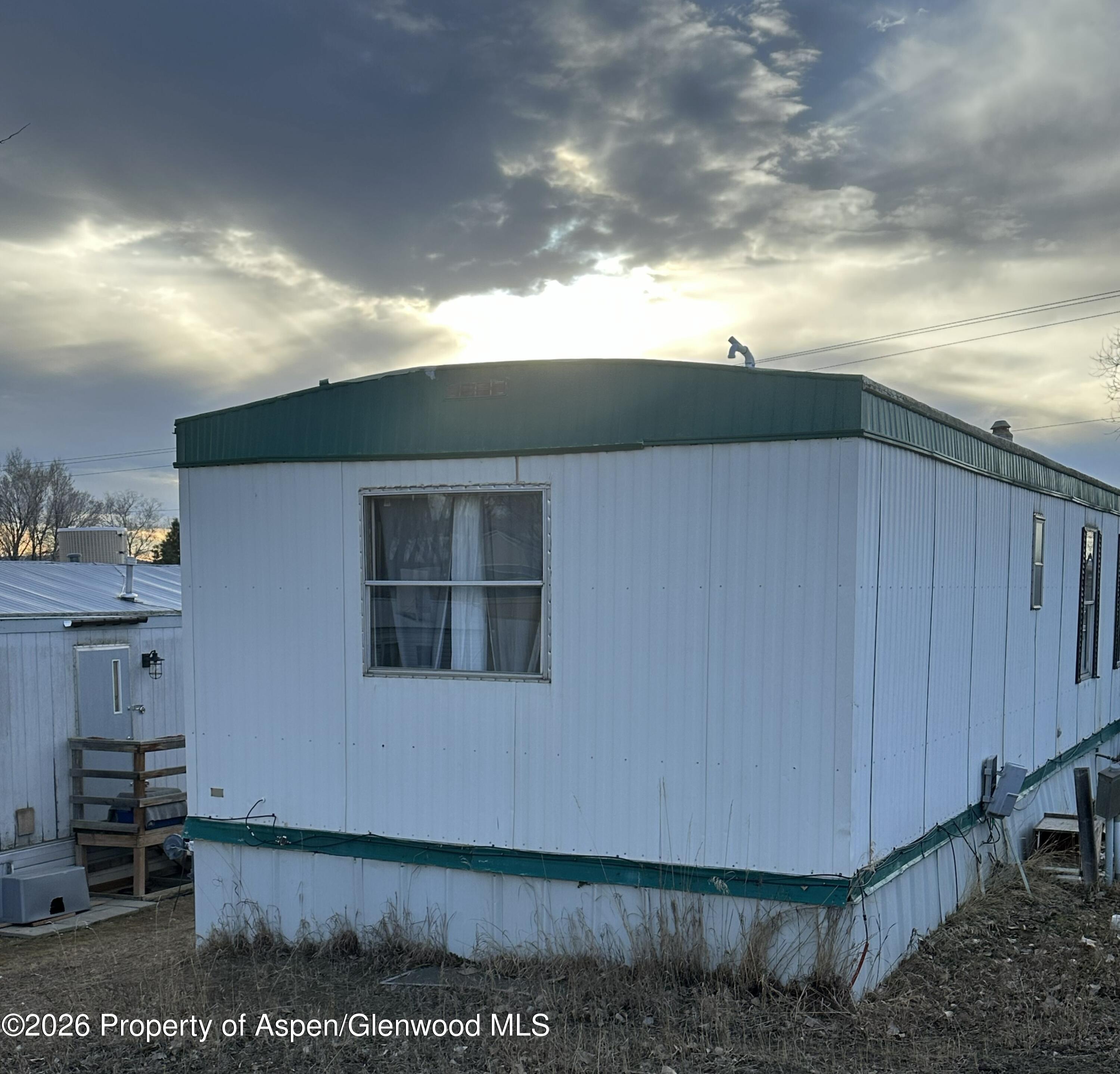 825 East 7th Street, Unit 1 Craig, CO 81625 - Photo 3 of 3 a view of a house with a yard