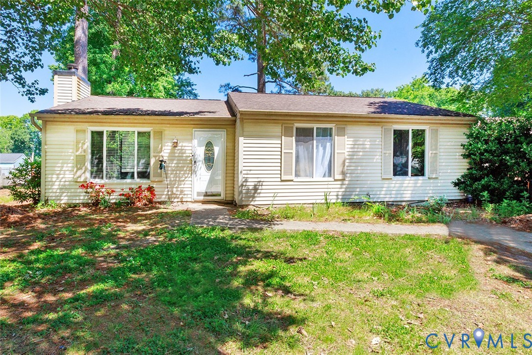 front view of a house with a yard