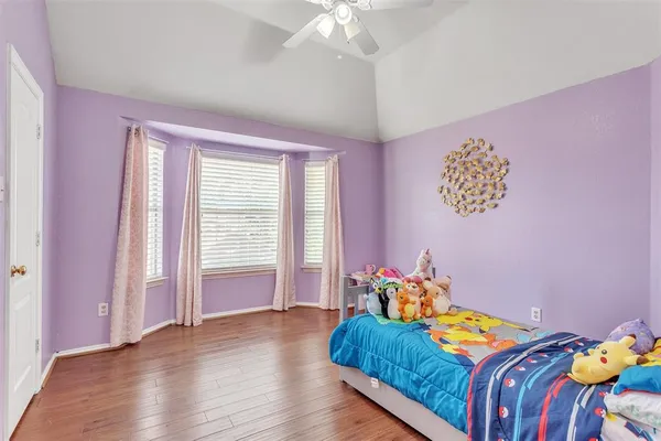 a bed room with a bed and a window