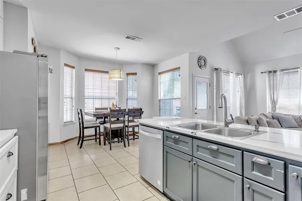 a view of a kitchen area with furniture and window