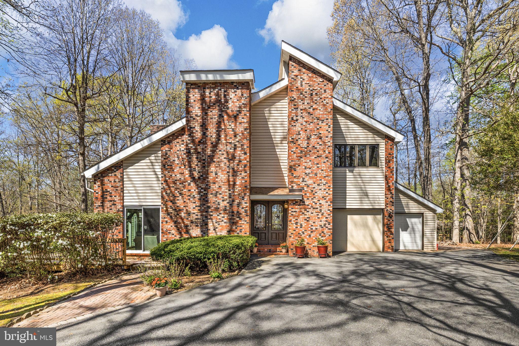 111 Chesterfield Court Locust Grove, VA 22508 - Photo 2 of 97 a front view of a house with a yard