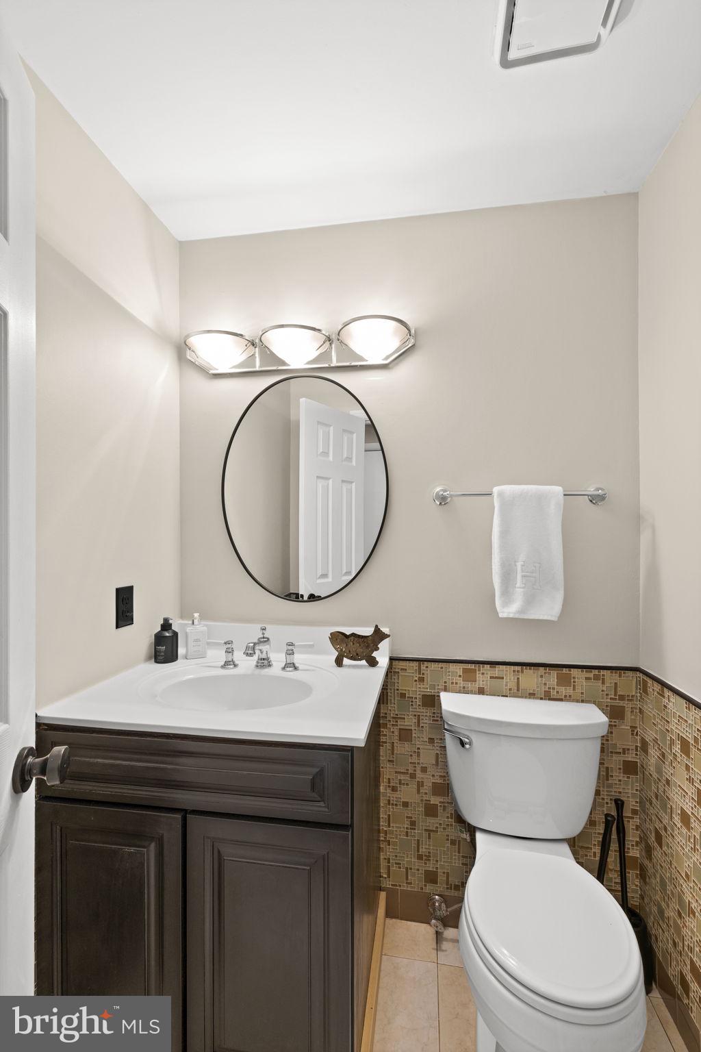 111 Chesterfield Court Locust Grove, VA 22508 - Photo 29 of 97 a bathroom with a toilet a sink and a mirror