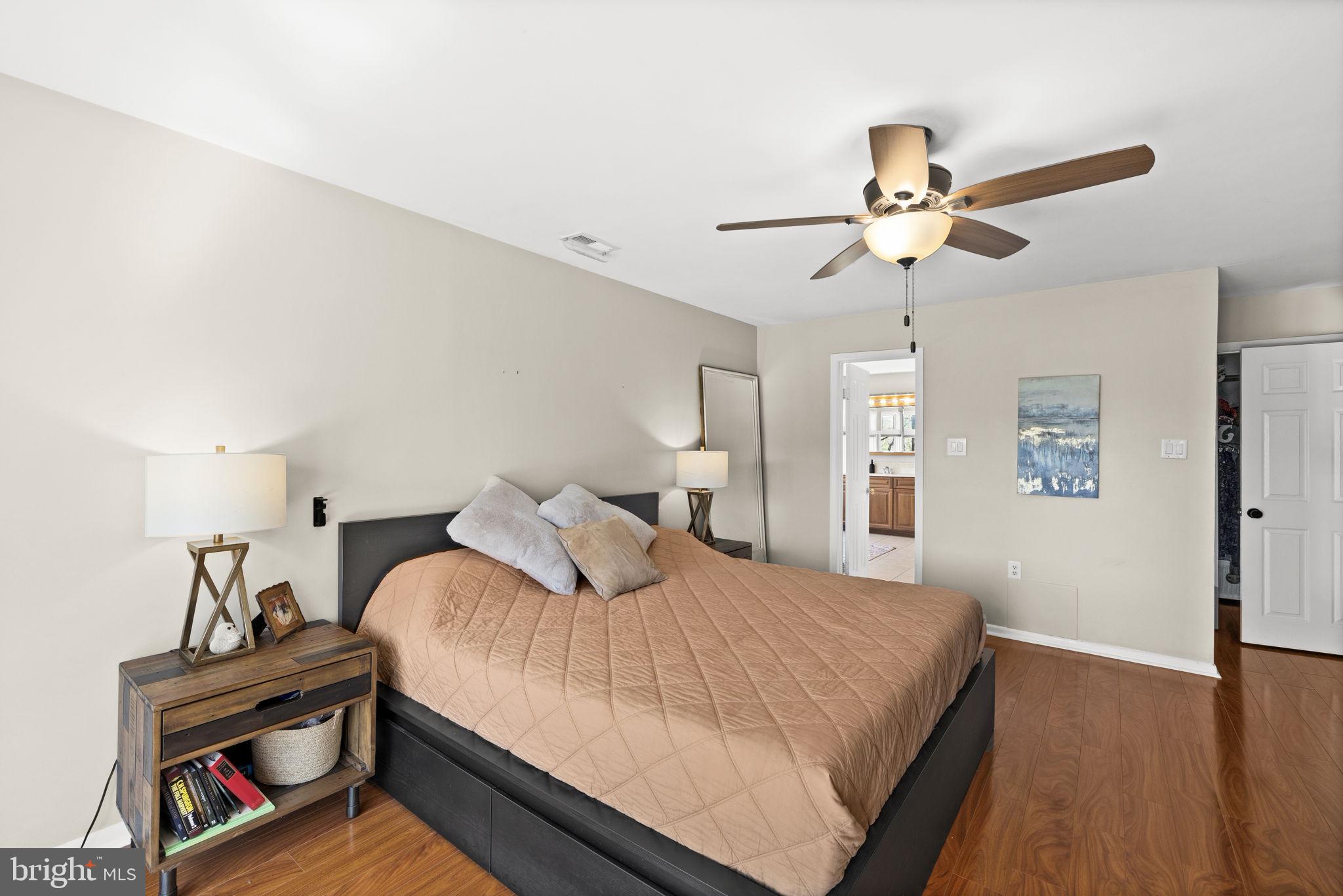 111 Chesterfield Court Locust Grove, VA 22508 - Photo 34 of 97 a bedroom with a bed and a chandelier