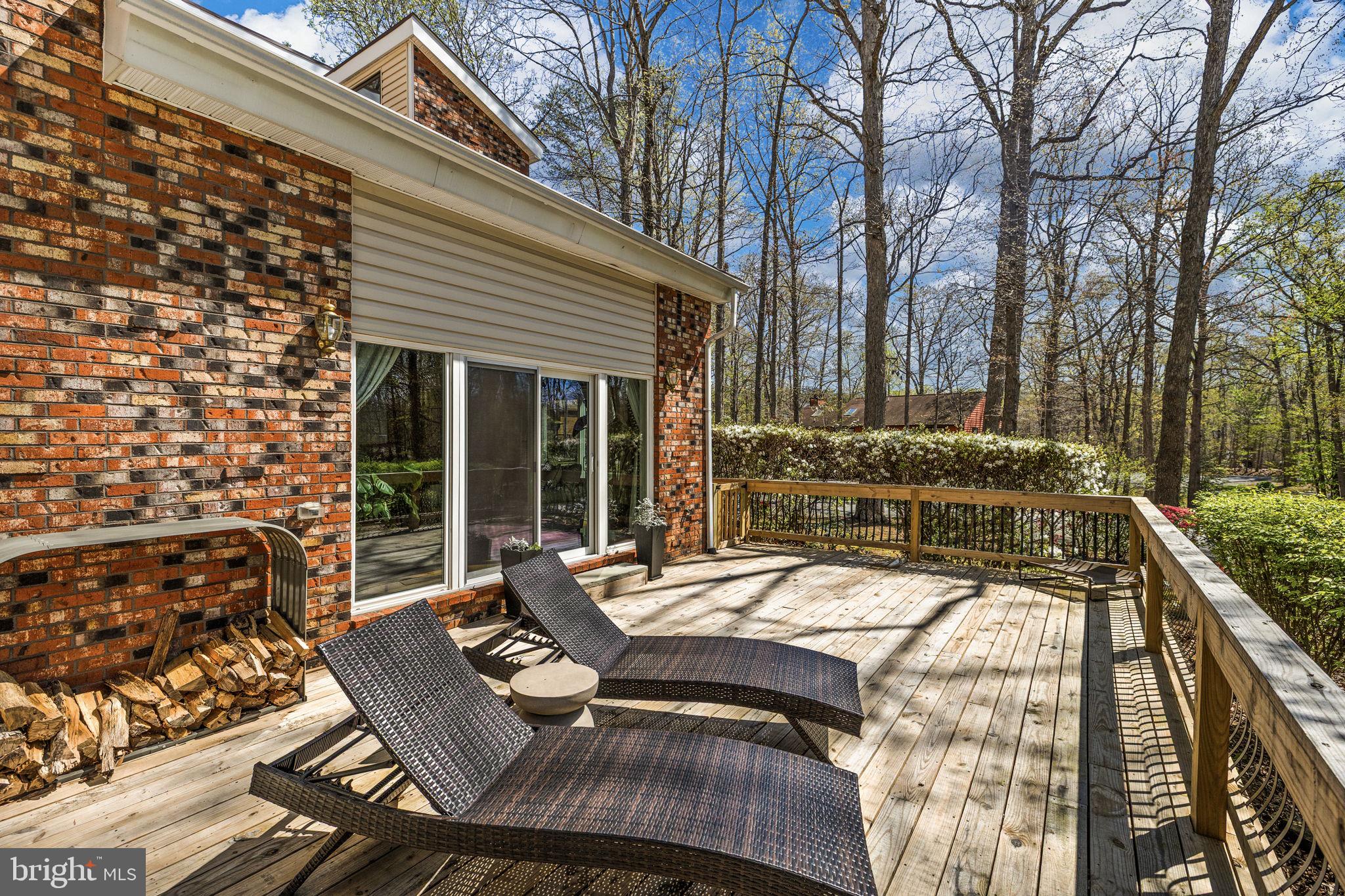 111 Chesterfield Court Locust Grove, VA 22508 - Photo 6 of 97 a view of a patio with table and chairs with wooden floor and fence