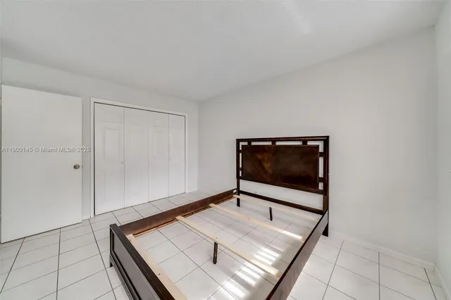 a bathroom with a granite countertop sink toilet and bathtub