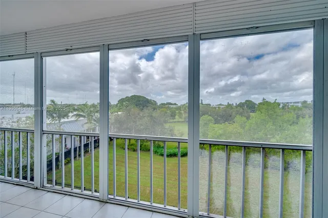 a view of a glass door and a balcony