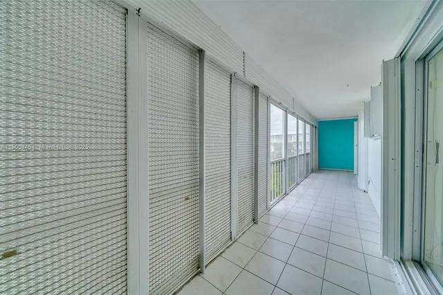 a view of balcony with yard