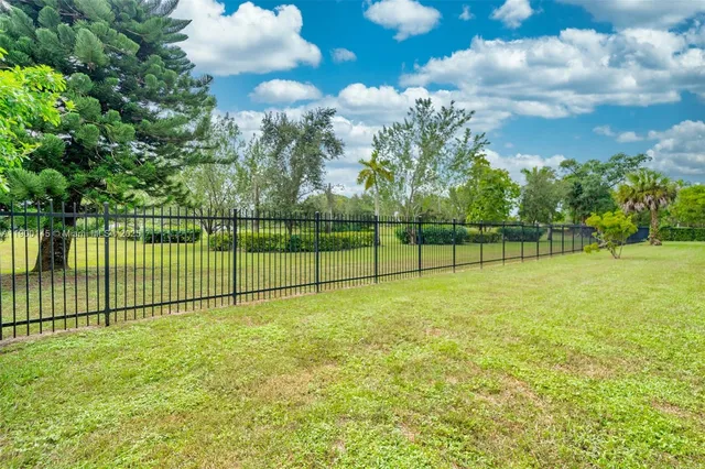 a view of an empty room and a window