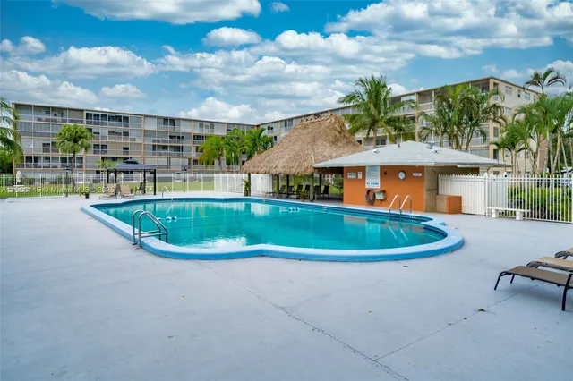 a view of a swimming pool with a patio