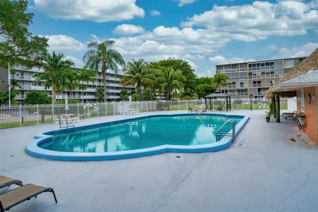 a view of a table and chairs in the garden