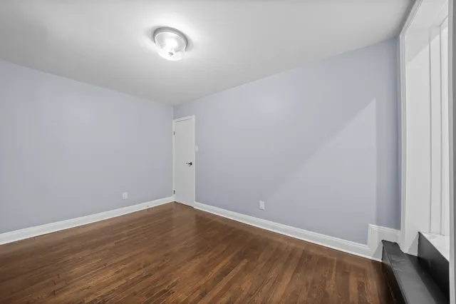 a view of room with wooden floor