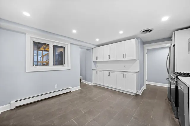 a view of a room with air conditioner and windows