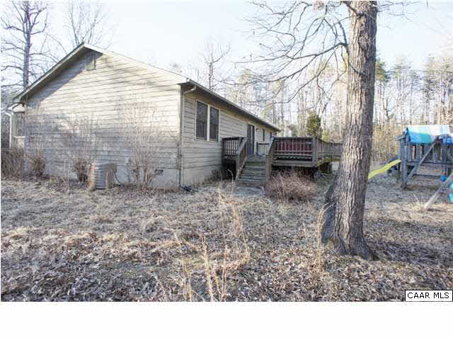 4608 Venable Road Kents Store, VA 23084 - Photo 18 of 18 a backyard of a house with barbeque oven table and chairs