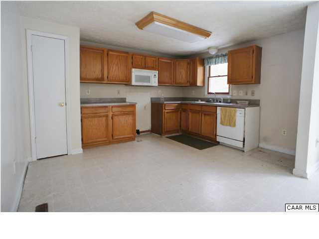 4608 Venable Road Kents Store, VA 23084 - Photo 3 of 18 a kitchen with granite countertop a sink cabinets and stainless steel appliances
