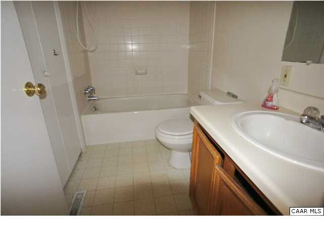 4608 Venable Road Kents Store, VA 23084 - Photo 9 of 18 a bathroom with a sink a toilet and shower