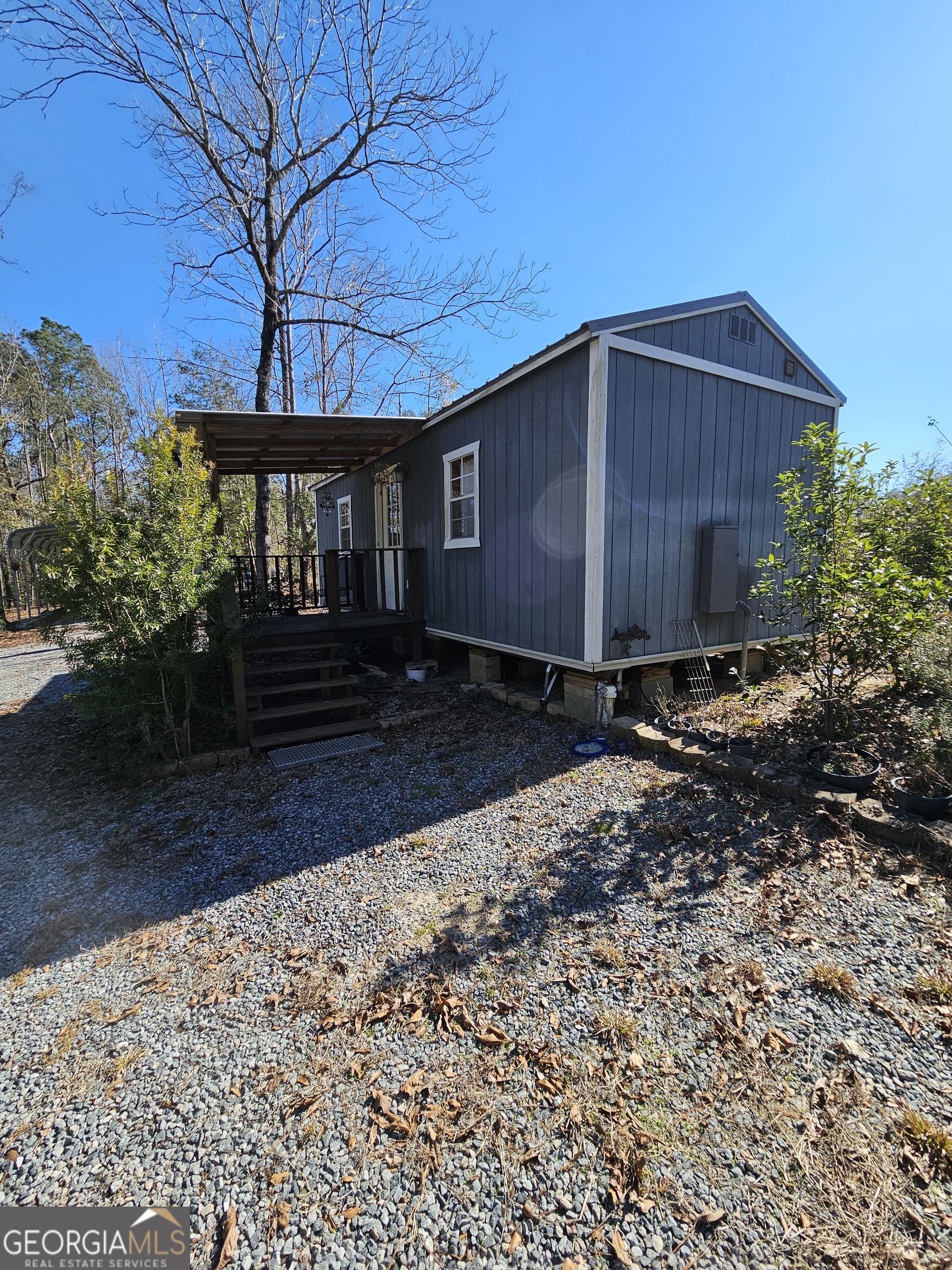 2262 Carter Bight Landing Road Surrency, GA 31563 - Photo 12 of 18 a front view of a house with yard and trees