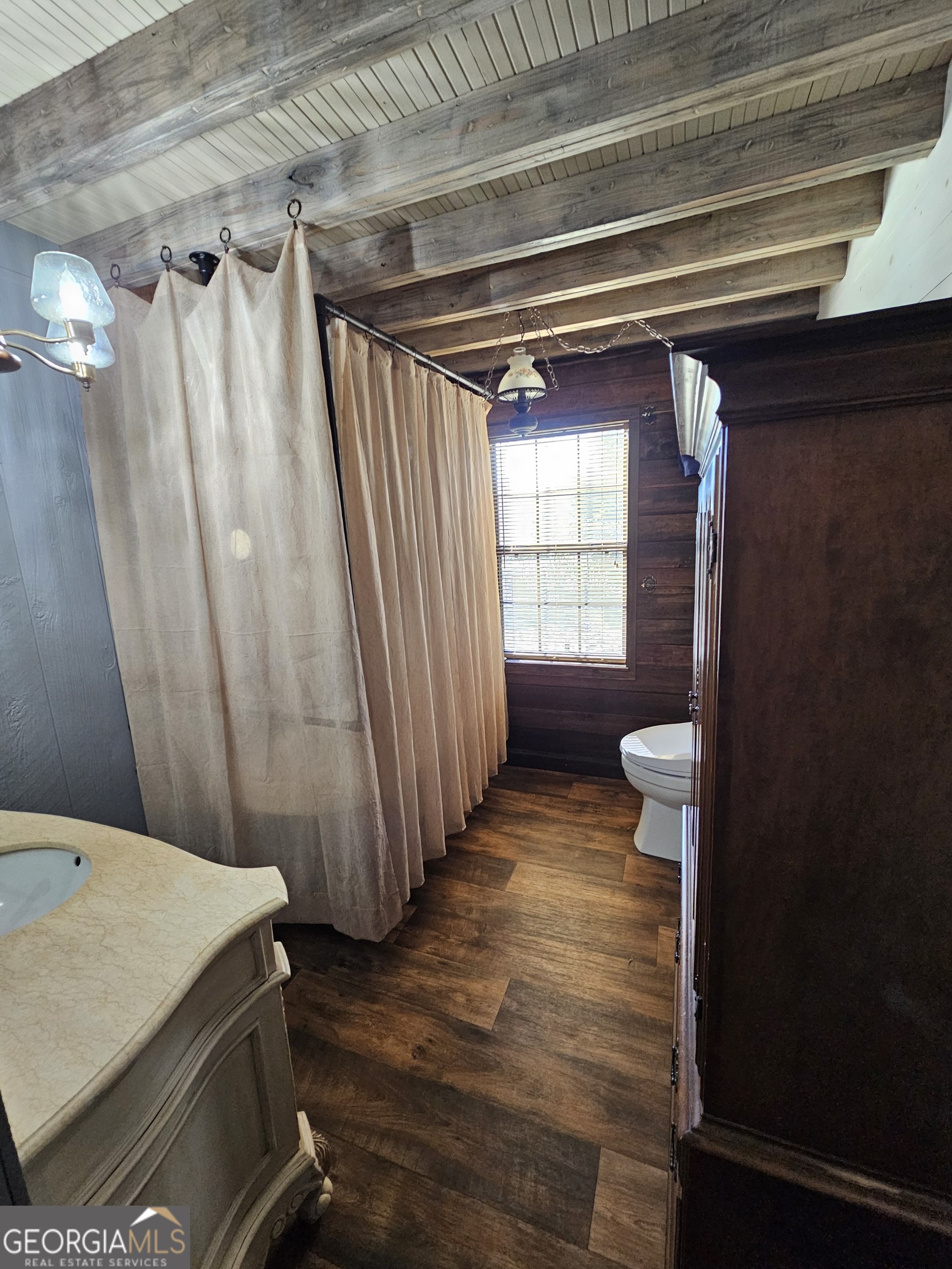 2262 Carter Bight Landing Road Surrency, GA 31563 - Photo 18 of 18 a bathroom with a sink and a shower