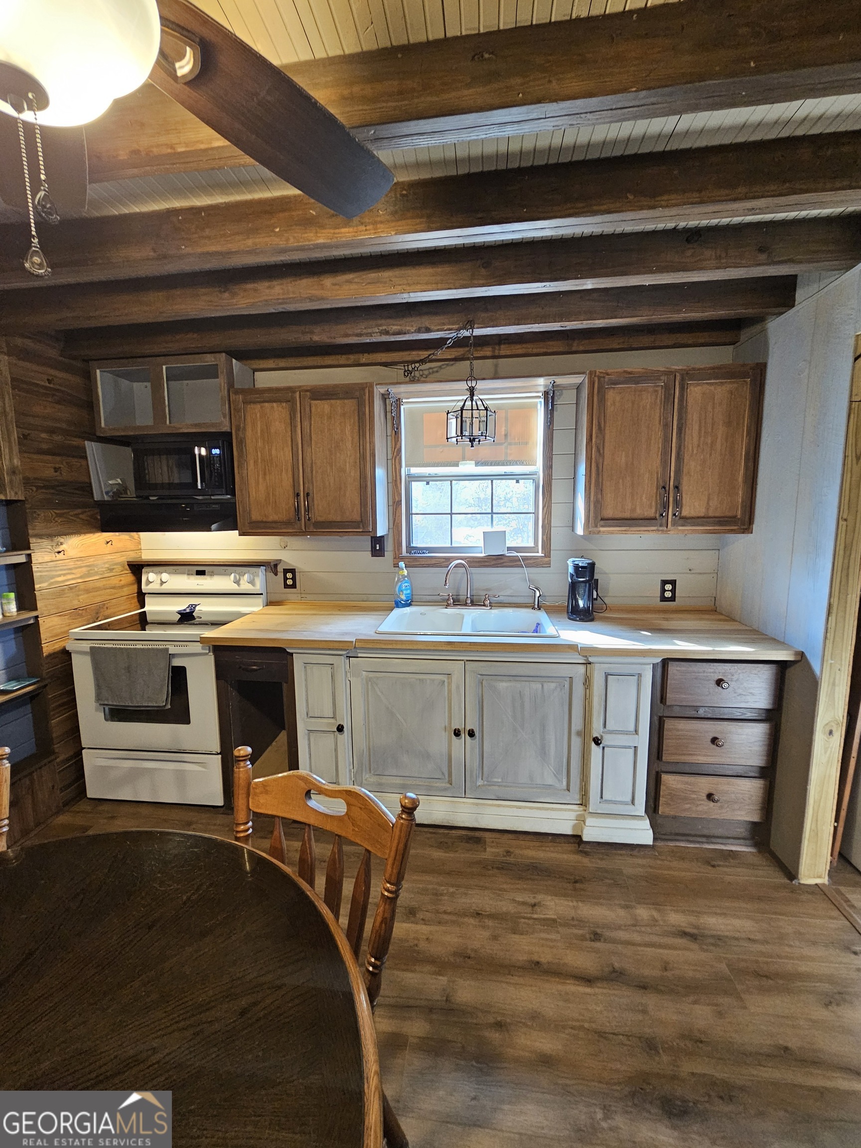 2262 Carter Bight Landing Road Surrency, GA 31563 - Photo 3 of 18 a kitchen with a stove a sink and a refrigerator