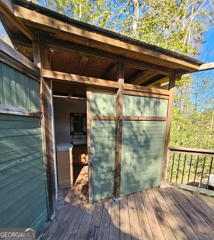 a view of outdoor space with wooden floor