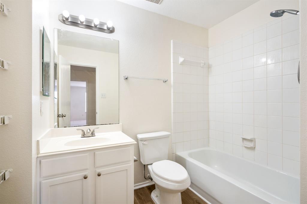 1626 White Oak Road Anna, TX 75409 - Photo 10 of 30 a bathroom with a sink toilet a shower and a mirror