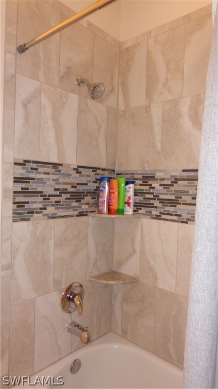 8261 Pathfinder Loop, Unit 745 Fort Myers, FL 33919 - Photo 11 of 20 a bathroom with a shower and a sink