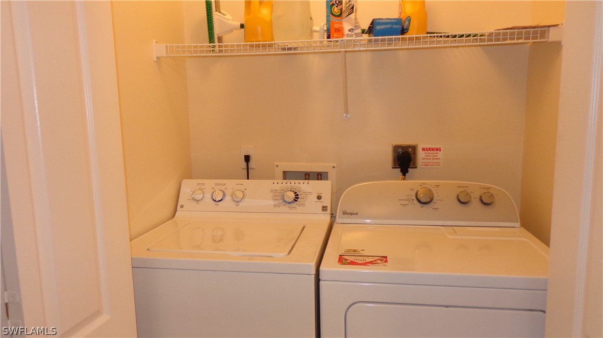 8261 Pathfinder Loop, Unit 745 Fort Myers, FL 33919 - Photo 12 of 20 a utility room with dryer and washer