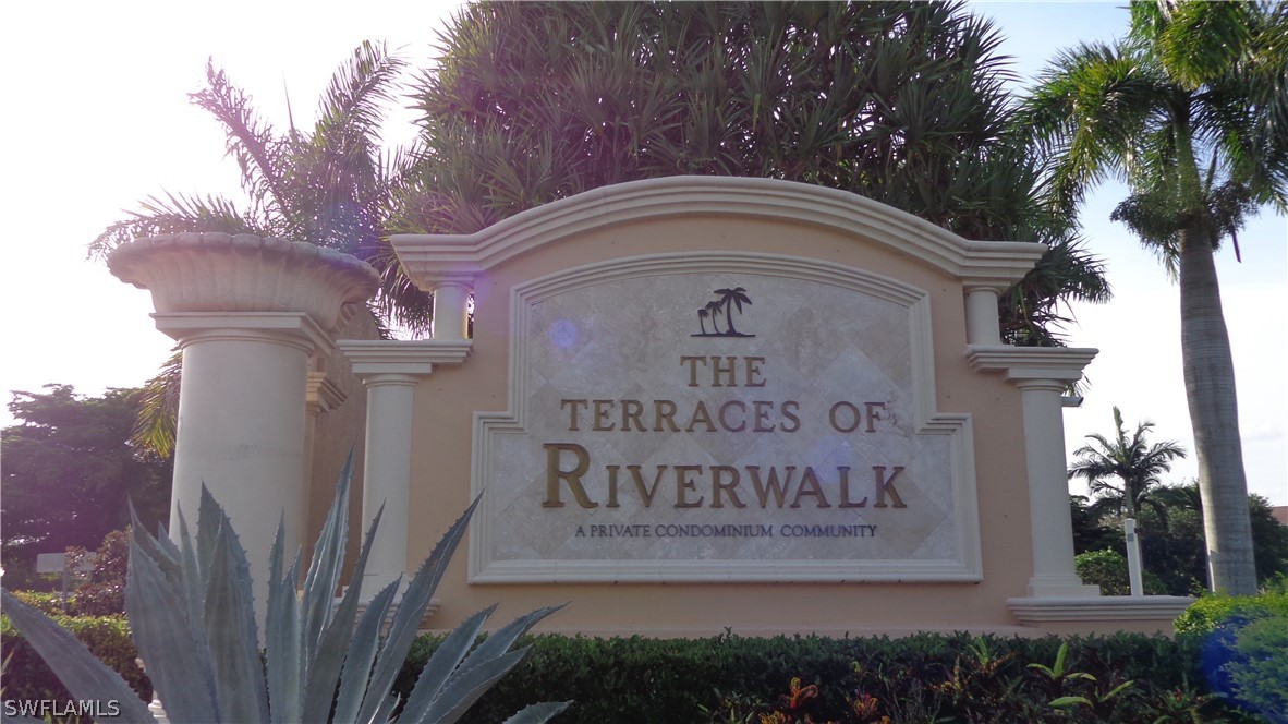 8261 Pathfinder Loop, Unit 745 Fort Myers, FL 33919 - Photo 18 of 20 a sign on the side of a building