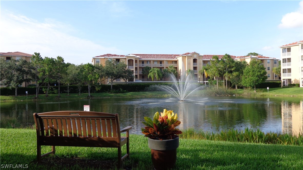 8261 Pathfinder Loop, Unit 745 Fort Myers, FL 33919 - Photo 19 of 20 a lake view with a sitting space garden and lake view