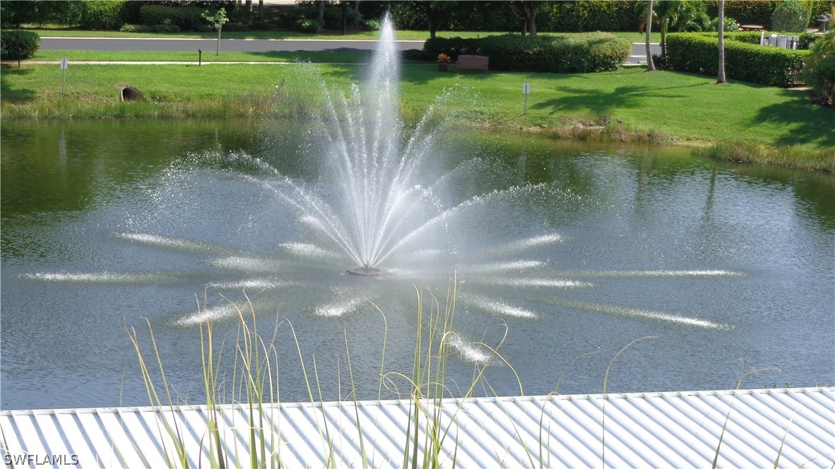 8261 Pathfinder Loop, Unit 745 Fort Myers, FL 33919 - Photo 20 of 20 a view of a swimming pool with a yard