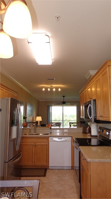 8261 Pathfinder Loop, Unit 745 Fort Myers, FL 33919 - Photo 6 of 20 a kitchen with a sink cabinets and stainless steel appliances